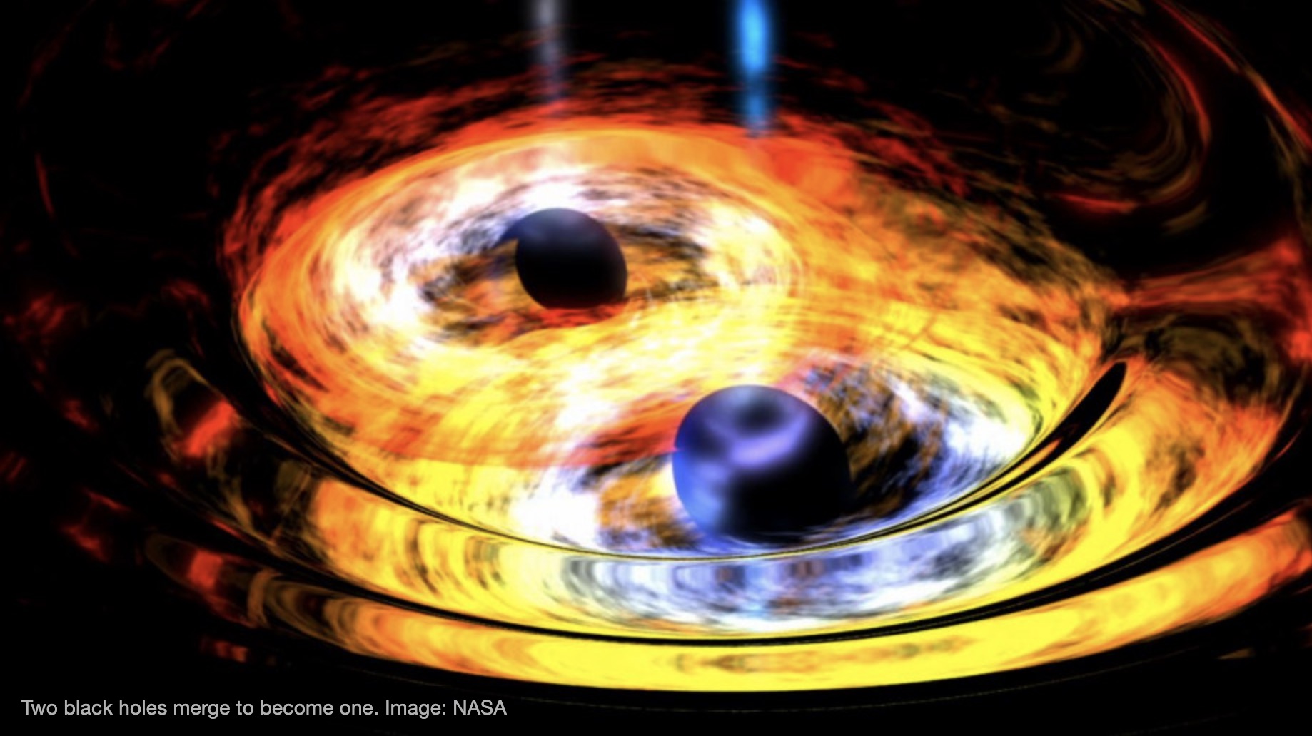 Two black holes merge to become one. Credit: NASA Two black holes merge to become one. Credit: NASA
