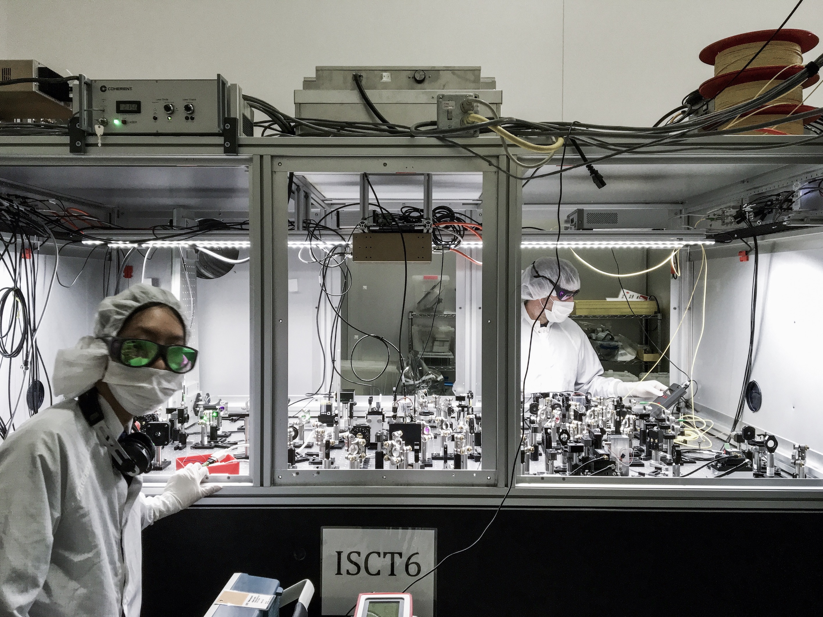 CGA PhD student Nutsinee Kijbunchoo (left) and postdoc Dr Terry McRae (right) building one of the squeezer tables at LIGO Hanford. Photo credit: N. Kijbunchoo. CGA PhD student Nutsinee Kijbunchoo (left) and postdoc Dr Terry McRae (right) building one of the squeezer tables at LIGO Hanford. Photo credit: N. Kijbunchoo.