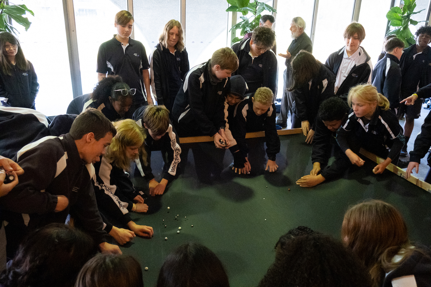 Primary school students experimenting with space-time simulator. Photo credit: Jesse Groch Primary school students experimenting with space-time simulator. Photo credit: Jesse Groch