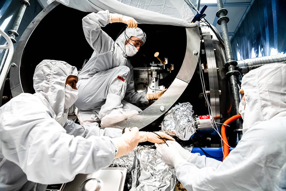 Image: LIGO team members (left-to-right: Fabrice Matichard, Sheila Dwyer, Hugh Radkins) install in-vacuum equipment as part of the squeezed-light upgrade. Credit: Nutsinee Kijbunchoo/ANU