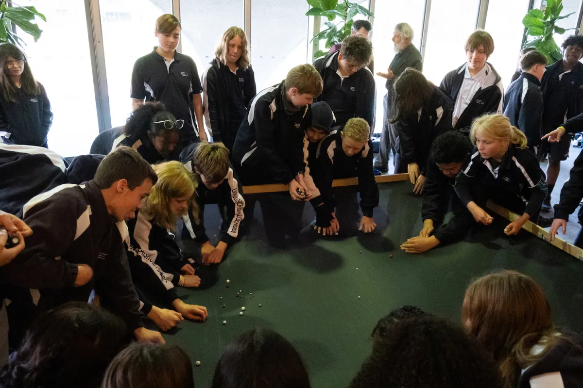 Primary school students experimenting with space-time simulator. Photo credit: Jesse Groch